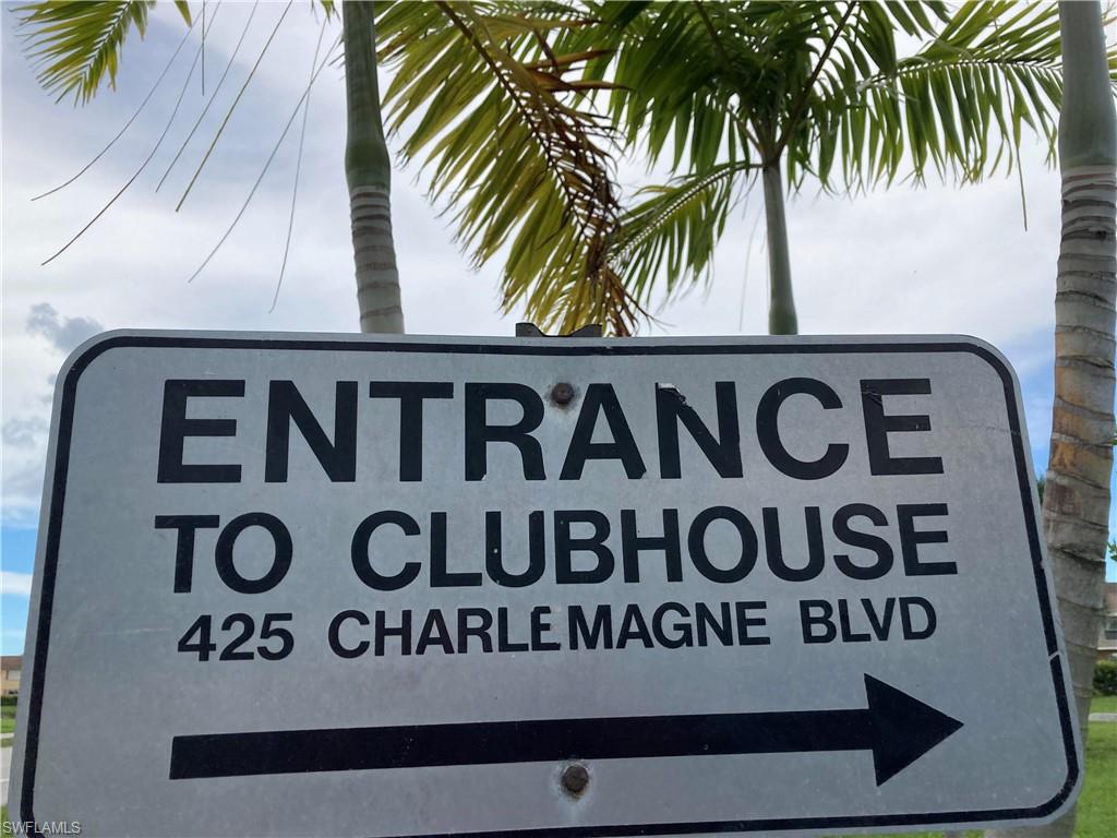 32 Lemans Drive Naples, FL 34112 - Photo 27 of 49 a view of sign board with potted plants