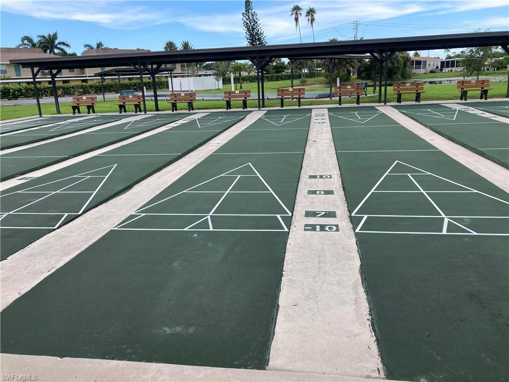 32 Lemans Drive Naples, FL 34112 - Photo 29 of 49 a view of a tennis court