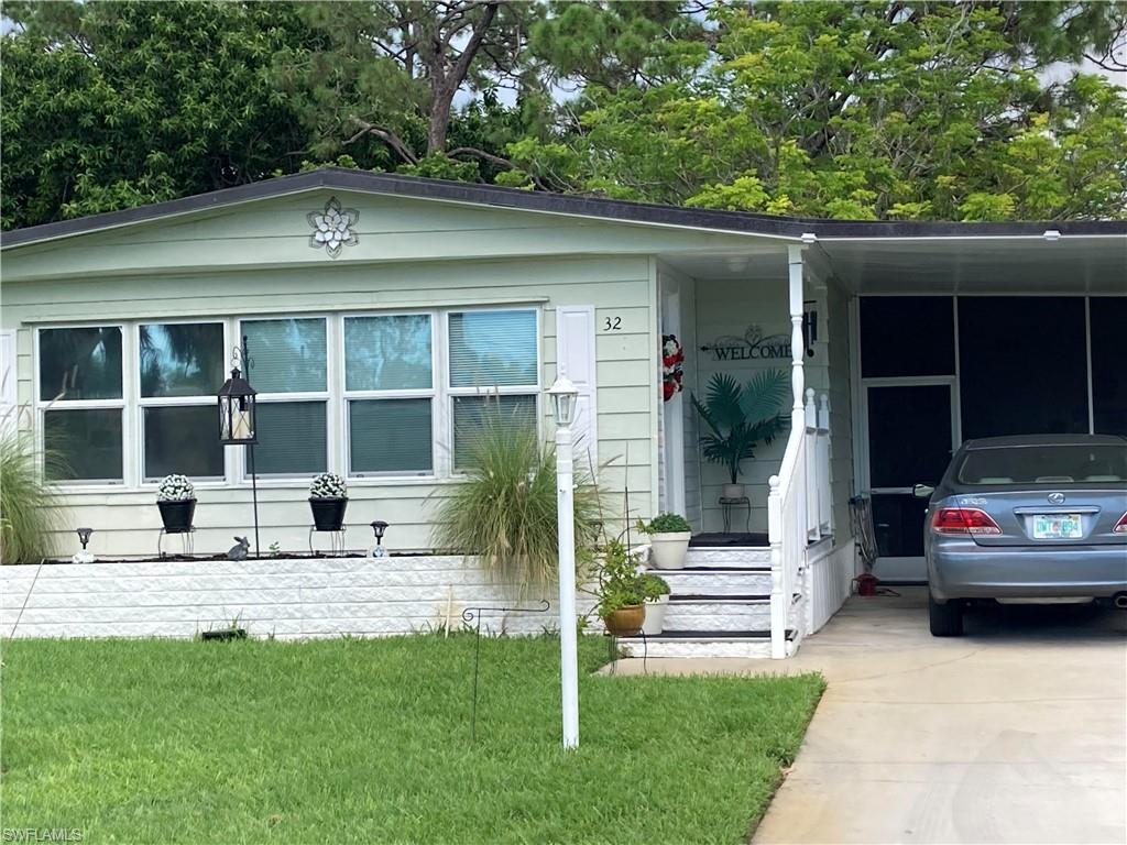 32 Lemans Drive Naples, FL 34112 - Photo 3 of 49 a view of a house with backyard and porch