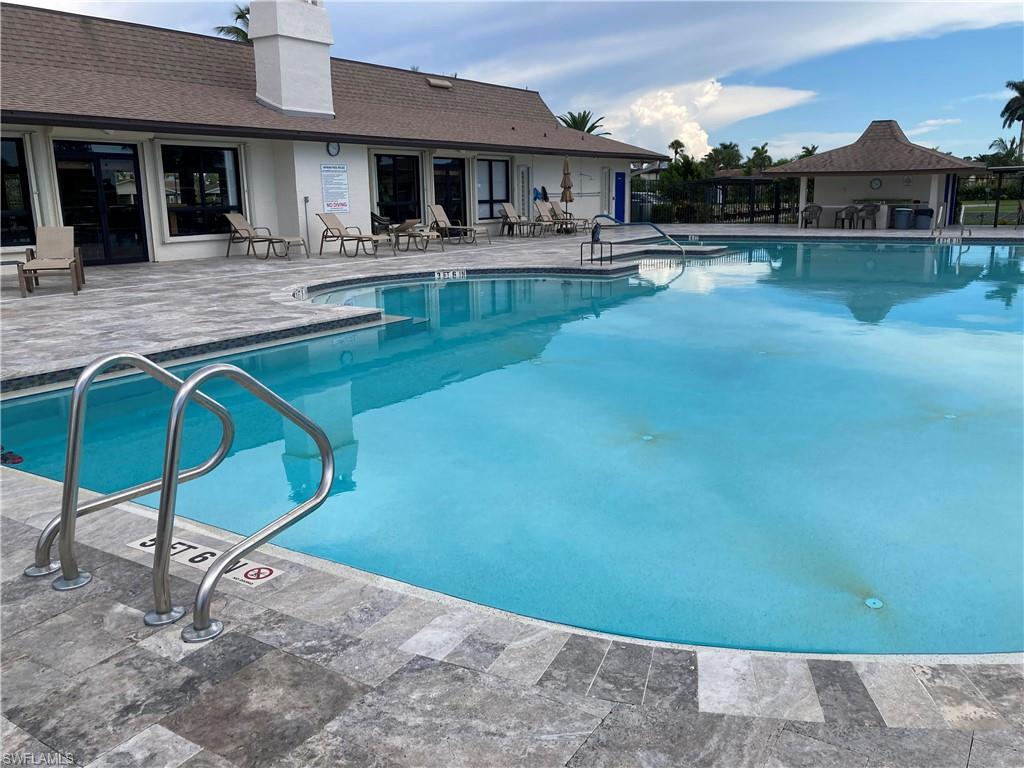 32 Lemans Drive Naples, FL 34112 - Photo 37 of 49 a house view with a outdoor space