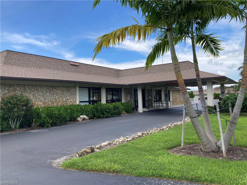 32 Lemans Drive Naples, FL 34112 - Photo 39 of 49 a front view of a house with a yard and entertaining space