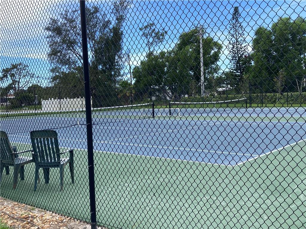 32 Lemans Drive Naples, FL 34112 - Photo 40 of 49 a view of outdoor space with a iron gate