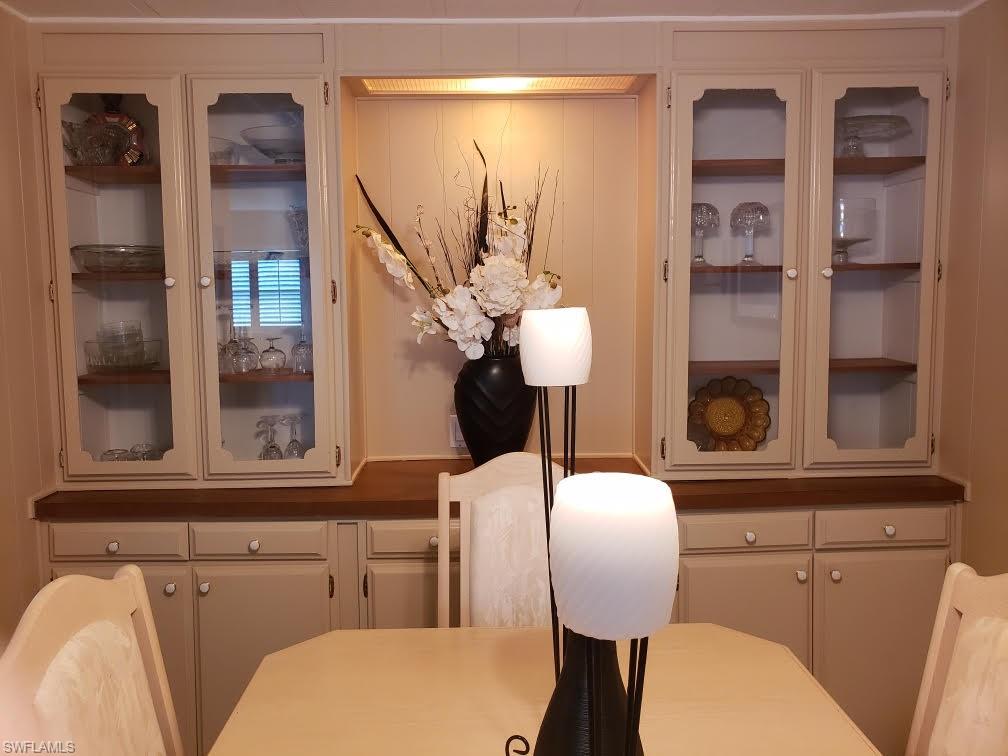 32 Lemans Drive Naples, FL 34112 - Photo 4 of 49 a bathroom with a toilet sink and mirror