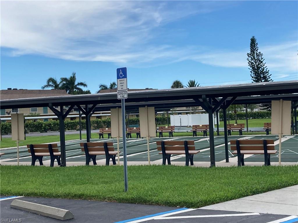 32 Lemans Drive Naples, FL 34112 - Photo 42 of 49 a view of a porch with furniture and garden
