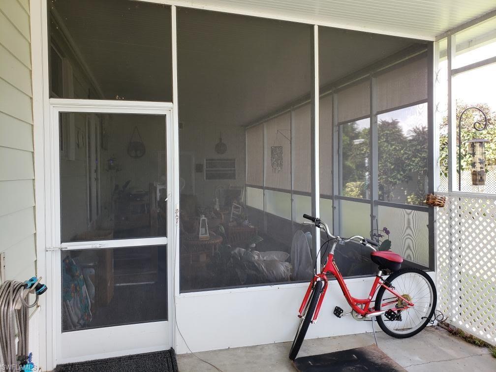 32 Lemans Drive Naples, FL 34112 - Photo 7 of 49 a bathroom with a shower and a wooden floor