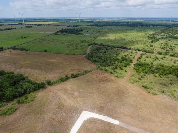 a view of a field with a yard