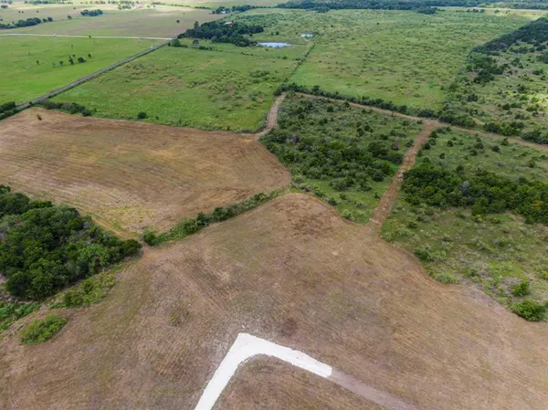 a view of a road with a yard