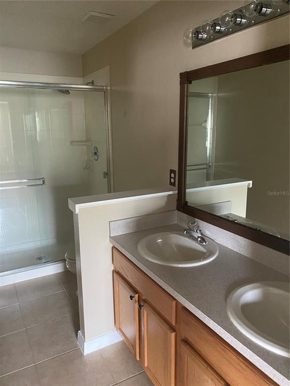 118 Philadelphia Way Winter Springs, FL 32708 - Photo 15 of 20 a bathroom with a sink and a mirror