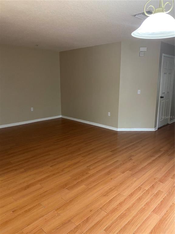 118 Philadelphia Way Winter Springs, FL 32708 - Photo 5 of 20 a view of an empty room and wooden floor