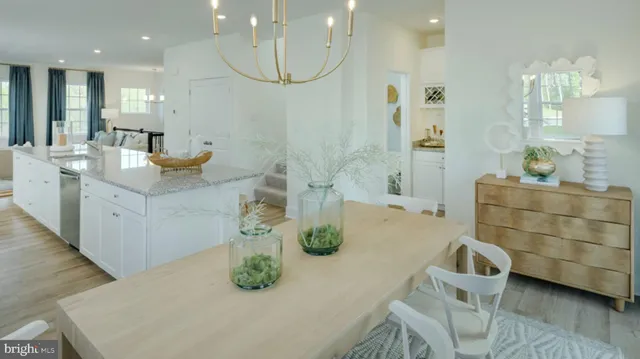 a bathroom with a double vanity sink a mirror and bathtub