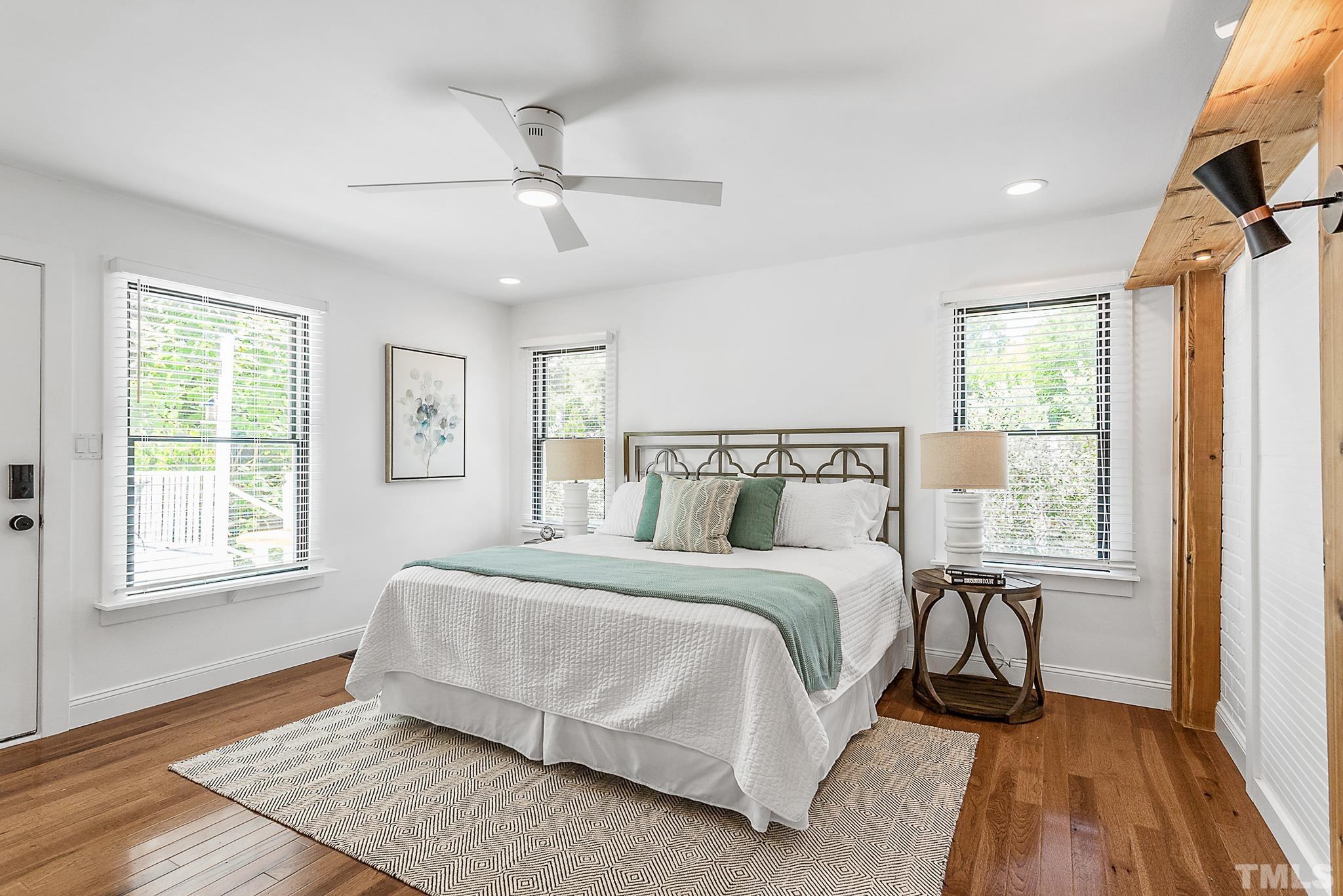 2222 Glascock Street Raleigh, NC 27610 - Photo 12 of 20 a bedroom with a bed lamp and a window
