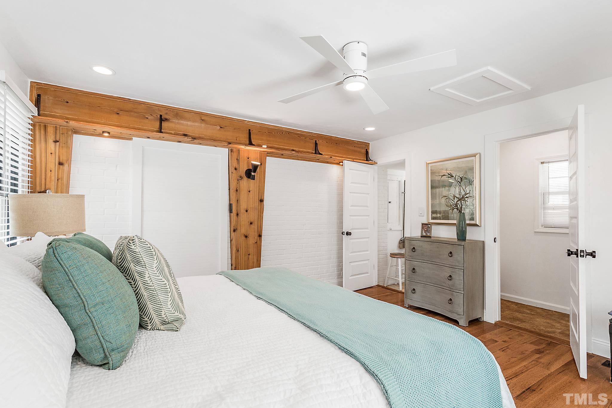 2222 Glascock Street Raleigh, NC 27610 - Photo 13 of 20 a bedroom with a bed and a dresser