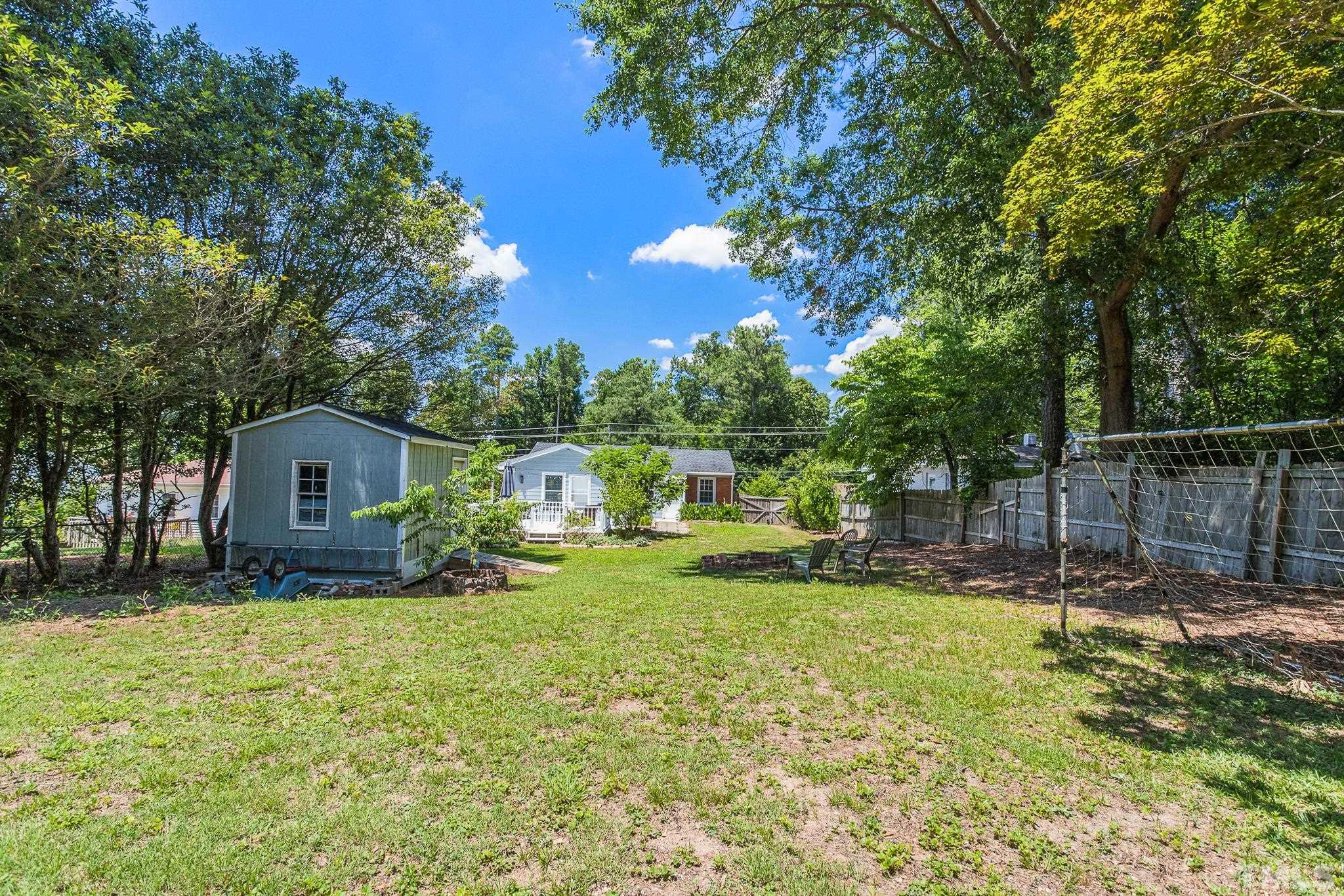 2222 Glascock Street Raleigh, NC 27610 - Photo 18 of 20 a view of a house with a yard and sitting area