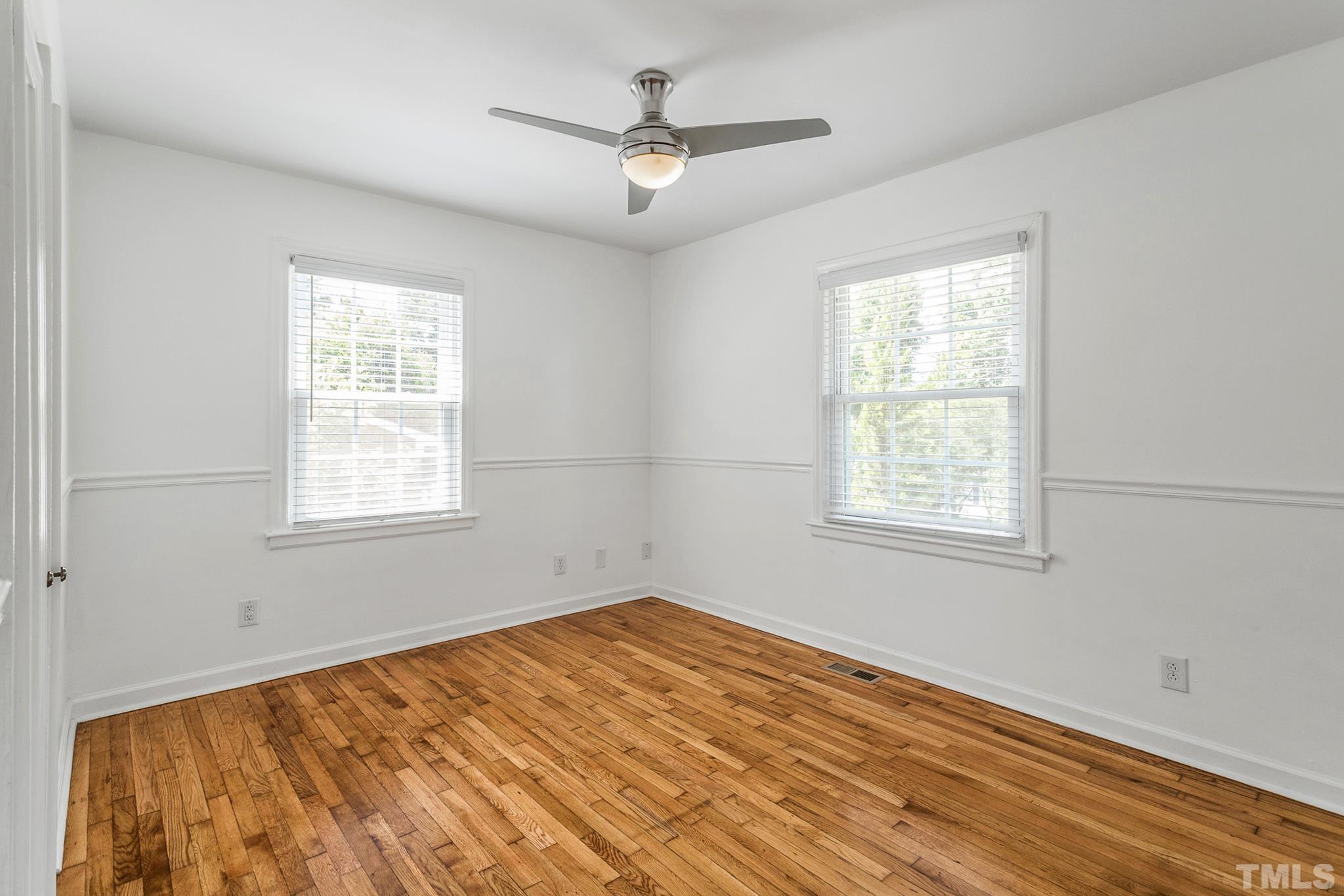 2222 Glascock Street Raleigh, NC 27610 - Photo 8 of 20 a view of a room with a window and ceiling fan