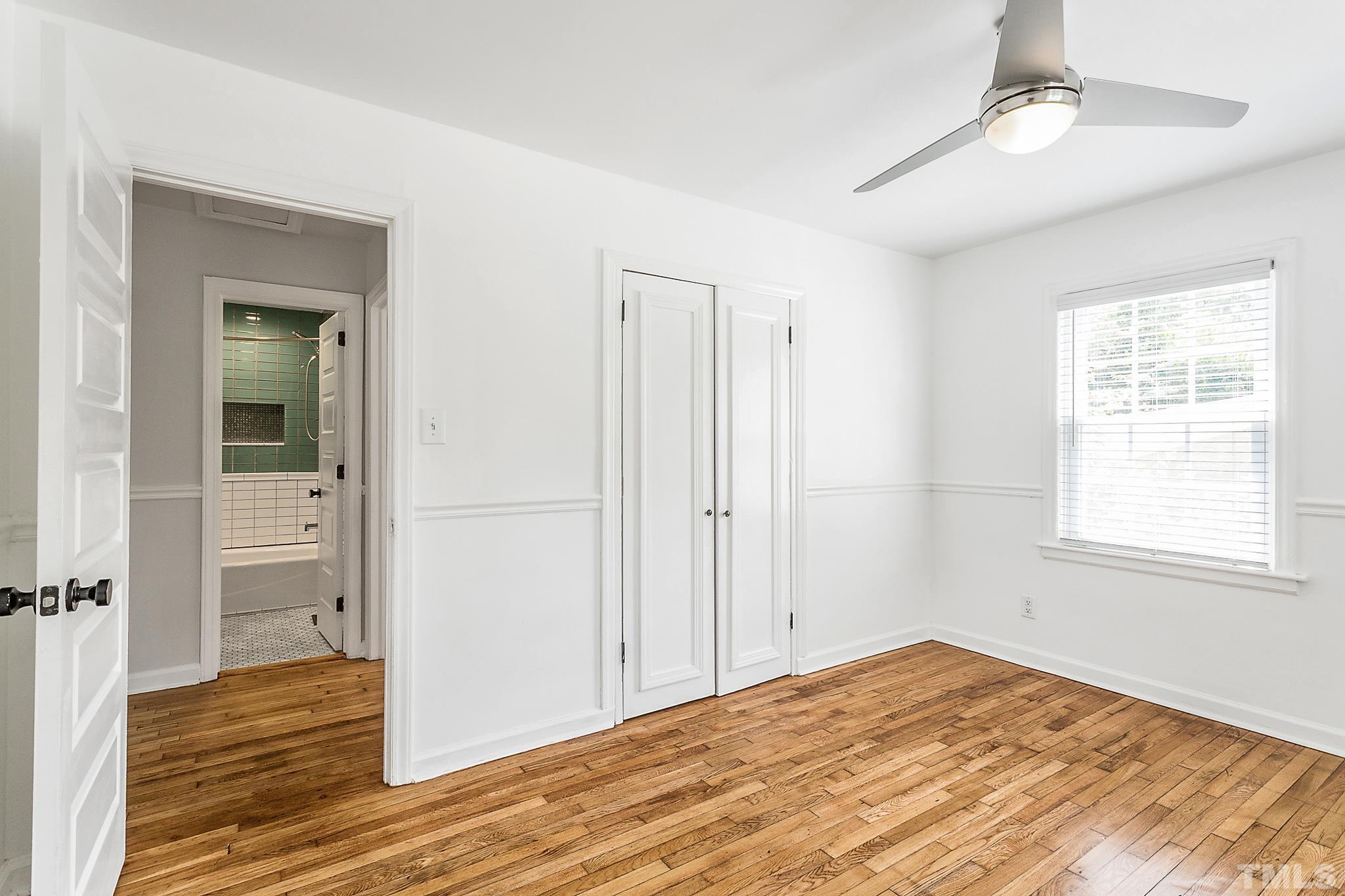 2222 Glascock Street Raleigh, NC 27610 - Photo 9 of 20 a view of empty room with wooden floor and fan