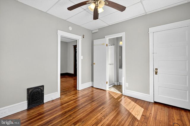 a white refrigerator freezer and a stove sitting inside of a kitchen