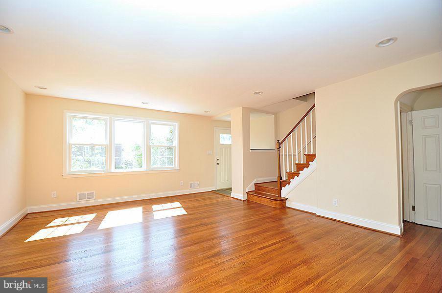 1841 Loch Shiel Road Baltimore, MD 21286 - Photo 2 of 23 a view of an empty room with wooden floor and a window