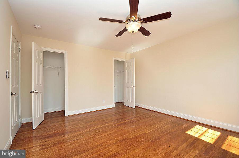 1841 Loch Shiel Road Baltimore, MD 21286 - Photo 11 of 23 an empty room with wooden floor fan and windows