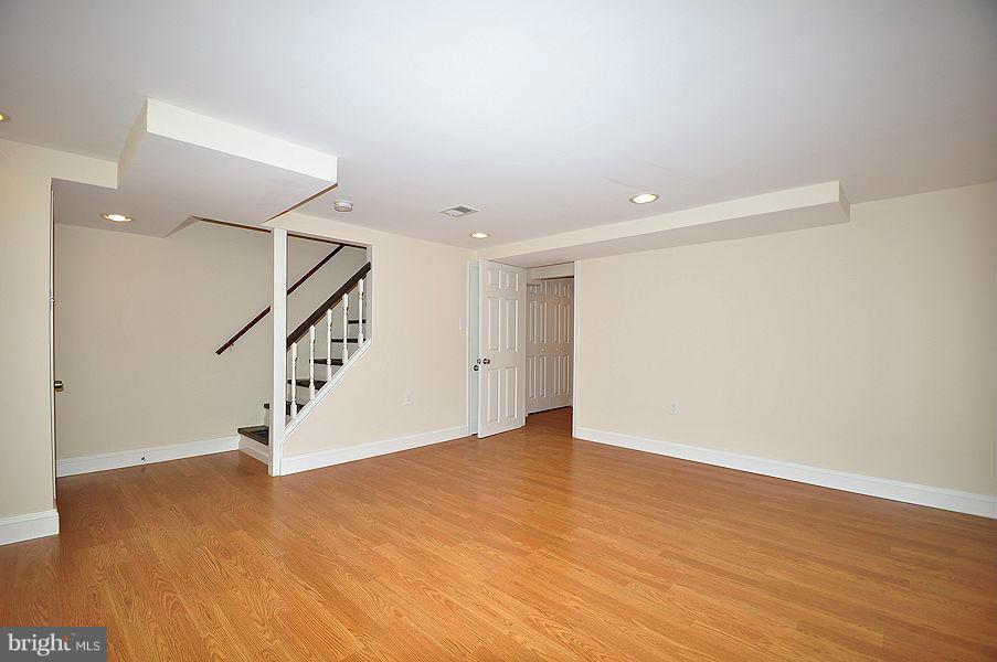 1841 Loch Shiel Road Baltimore, MD 21286 - Photo 15 of 23 a view of an empty room with wooden floor and stairs