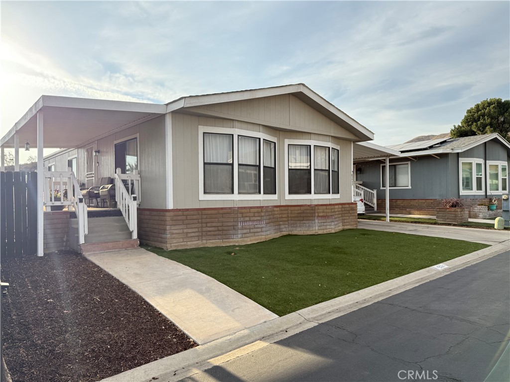 4080 Pedley Road, Unit 211 Jurupa Valley, CA 92509 - Photo 1 of 13 a view of a house with yard and chairs