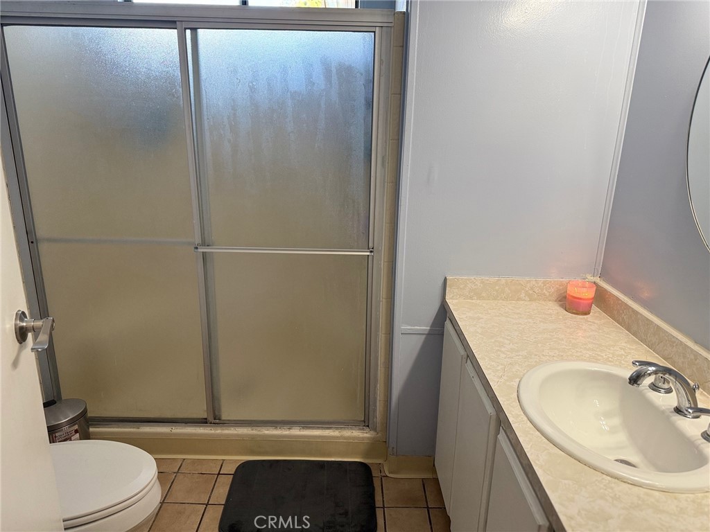 4080 Pedley Road, Unit 211 Jurupa Valley, CA 92509 - Photo 12 of 13 a bathroom with a sink and a toilet