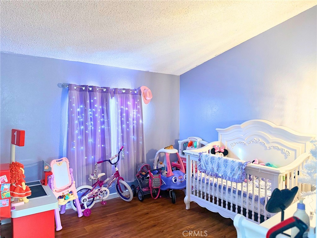 4080 Pedley Road, Unit 211 Jurupa Valley, CA 92509 - Photo 9 of 13 a bedroom with furniture and a window