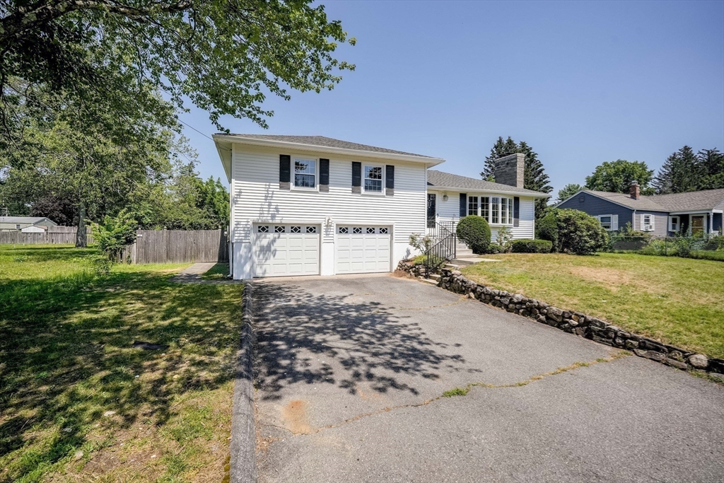 76 Clydesdale Lane Springfield, MA 01129 - Photo 31 of 39 a front view of a house with a yard