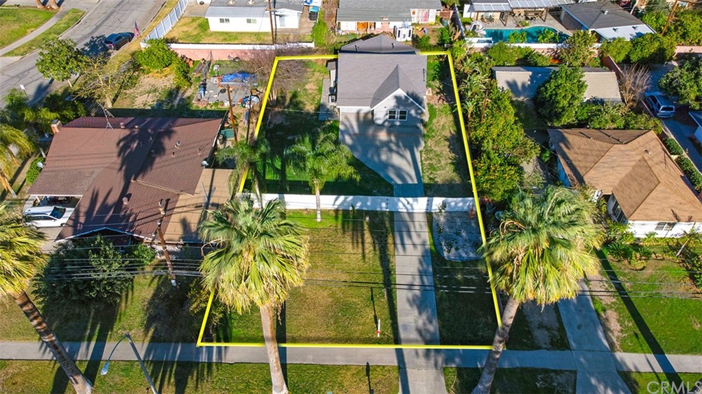 an aerial view of houses with yard