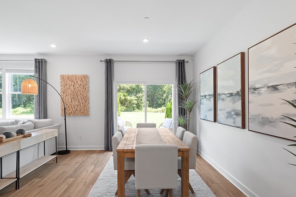 204 East Millbrook Drive Spring Hill, TN 37174 - Photo 16 of 38 a view of a dining room with furniture window and wooden floor