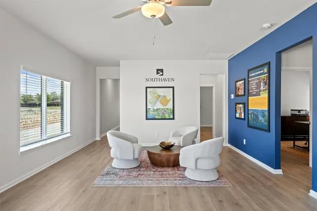 a room with furniture a wooden floor and a window