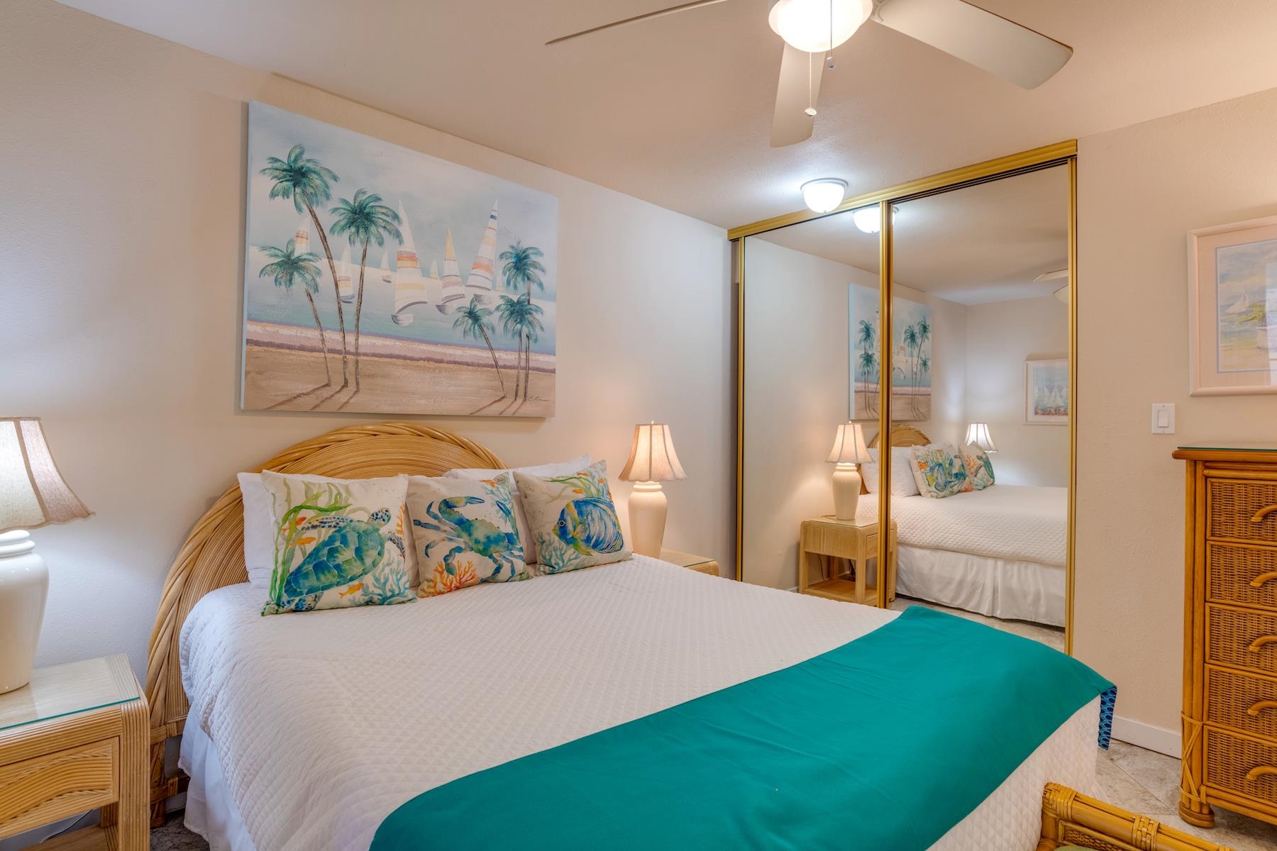 3601 Lower Honoapiilani Road, Unit 210 Lahaina, HI 96761 - Photo 17 of 25 a bedroom with a bed and a painting on the wall