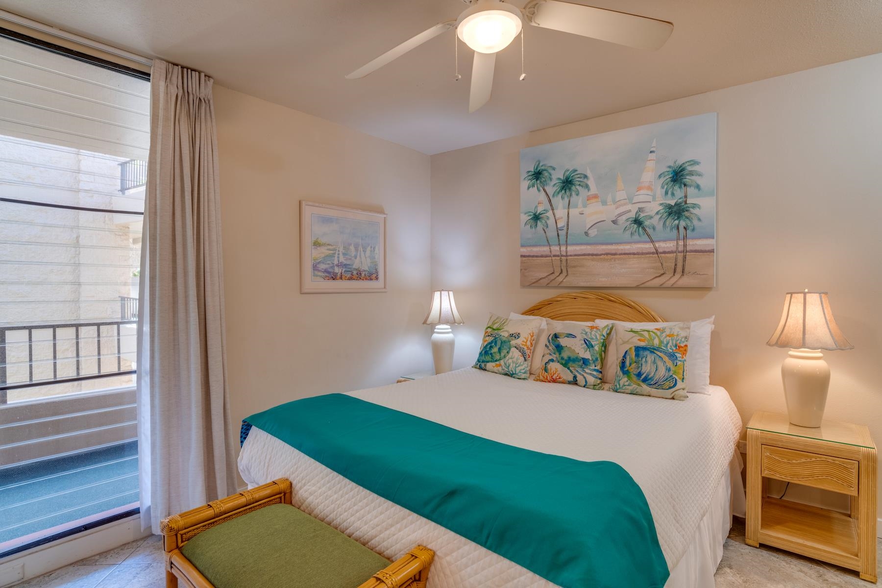 3601 Lower Honoapiilani Road, Unit 210 Lahaina, HI 96761 - Photo 19 of 25 a bedroom with a bed and a painting on the wall