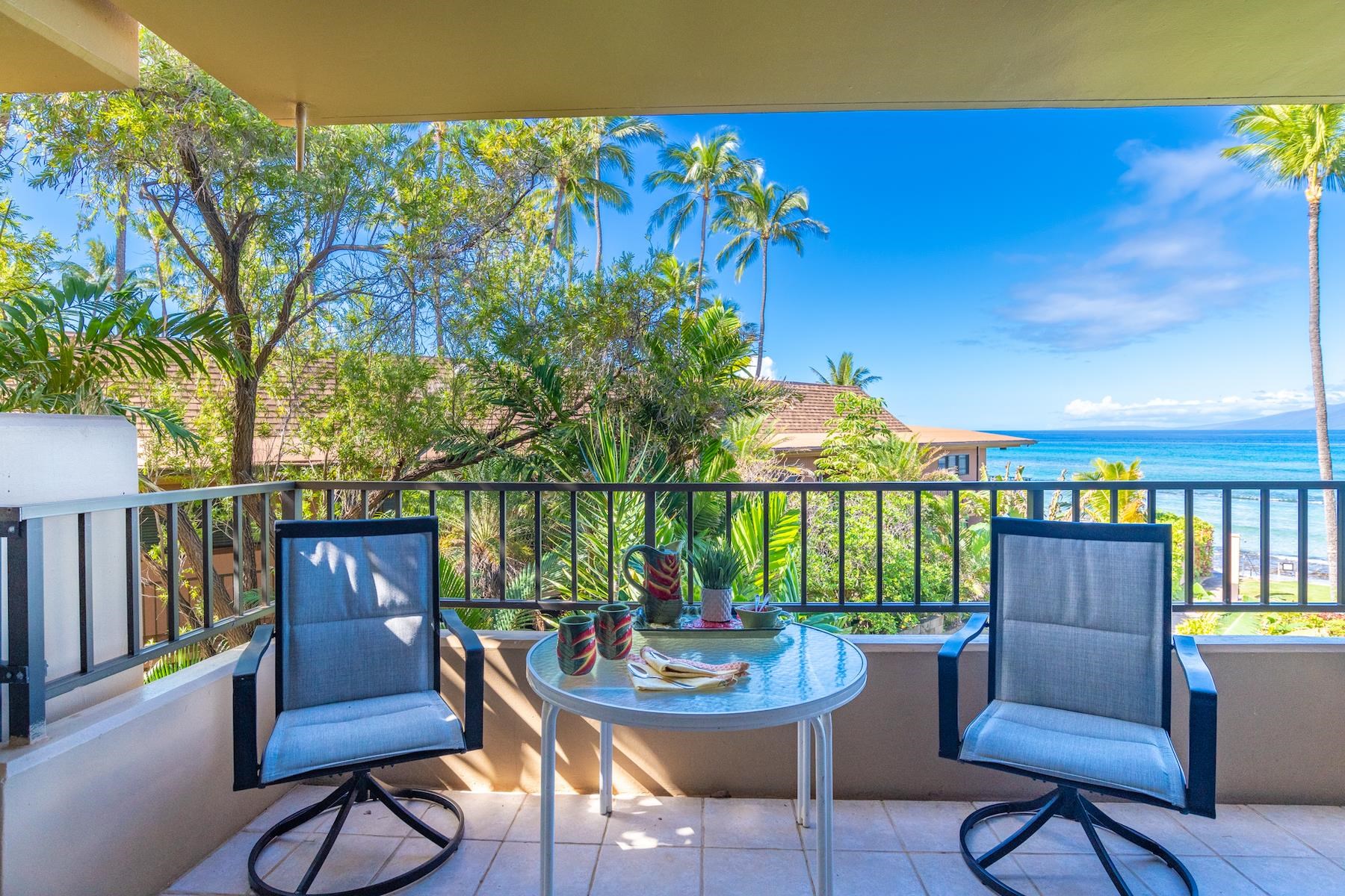 3601 Lower Honoapiilani Road, Unit 210 Lahaina, HI 96761 - Photo 3 of 25 a view of a chairs and table in patio with a lake view