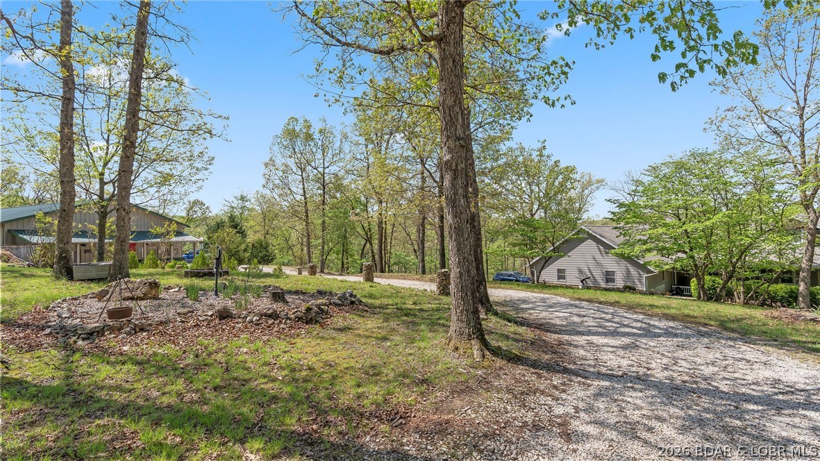 87 Perkins Road Sunrise Beach, MO 65079 - Photo 46 of 87 View of home and detached shop
