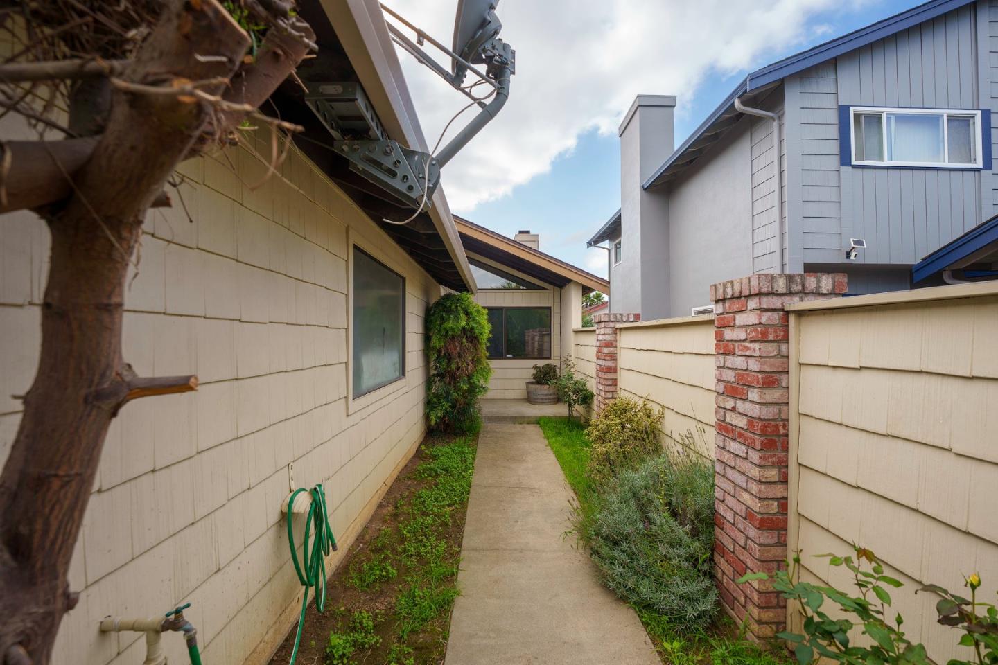1549 North First Street Salinas, CA 93906 - Photo 4 of 25 a pathway of a house with a yard
