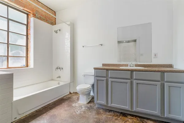 a bathroom with a sink toilet and bathtub