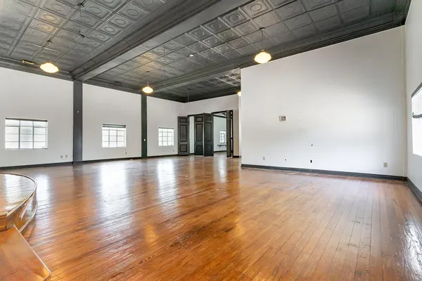 a view of a livingroom with wooden floor