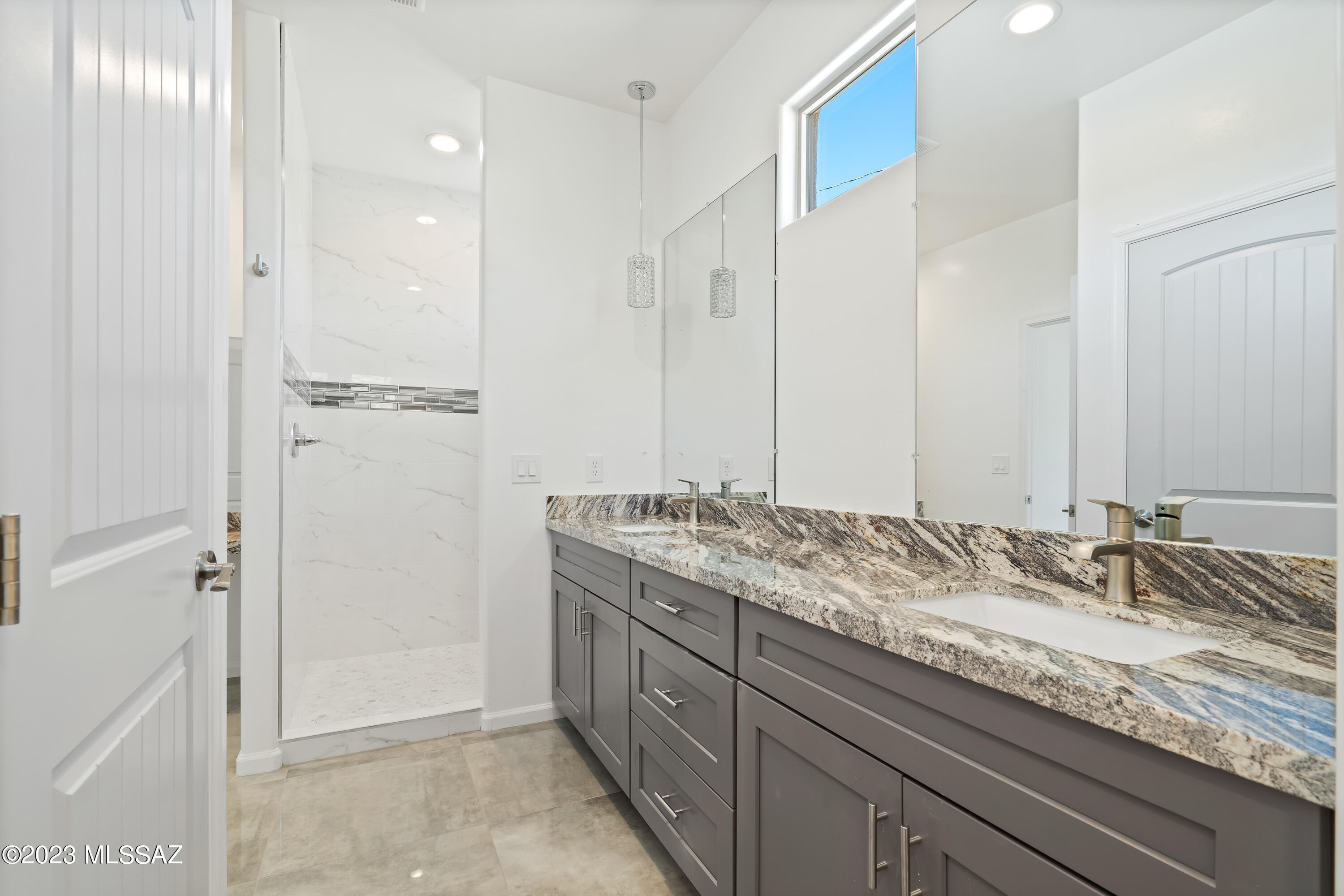 294 Circulo Cerro Rio Rico, AZ 85648 - Photo 19 of 38 a bathroom with a granite countertop sink and a mirror