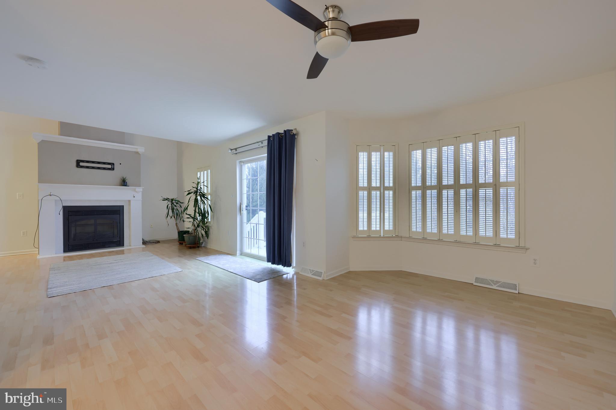1013 Kent Garden Lititz, PA 17543 - Photo 11 of 41 an empty room with windows and fireplace