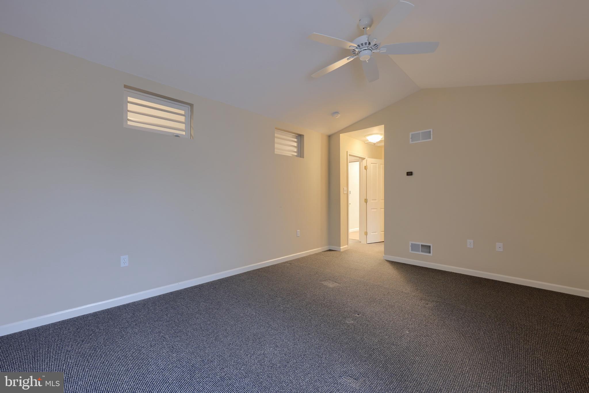 1013 Kent Garden Lititz, PA 17543 - Photo 27 of 41 an empty room with a ceiling fan and a window