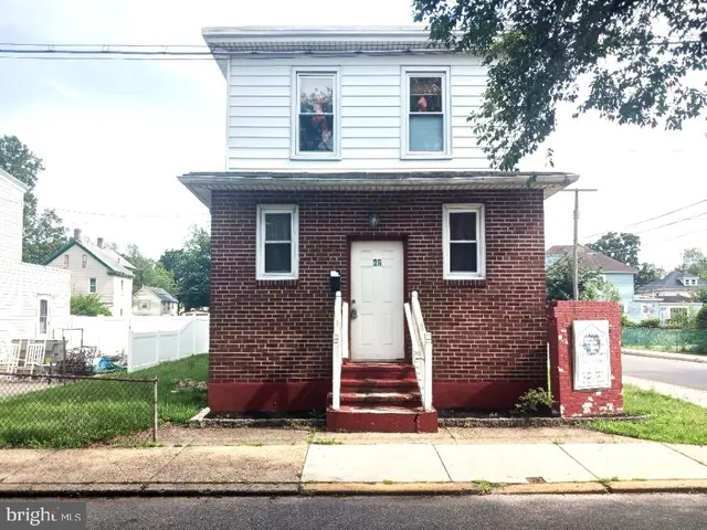 a front view of a house with garage