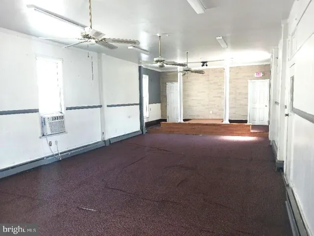 a view of a livingroom with a white walls