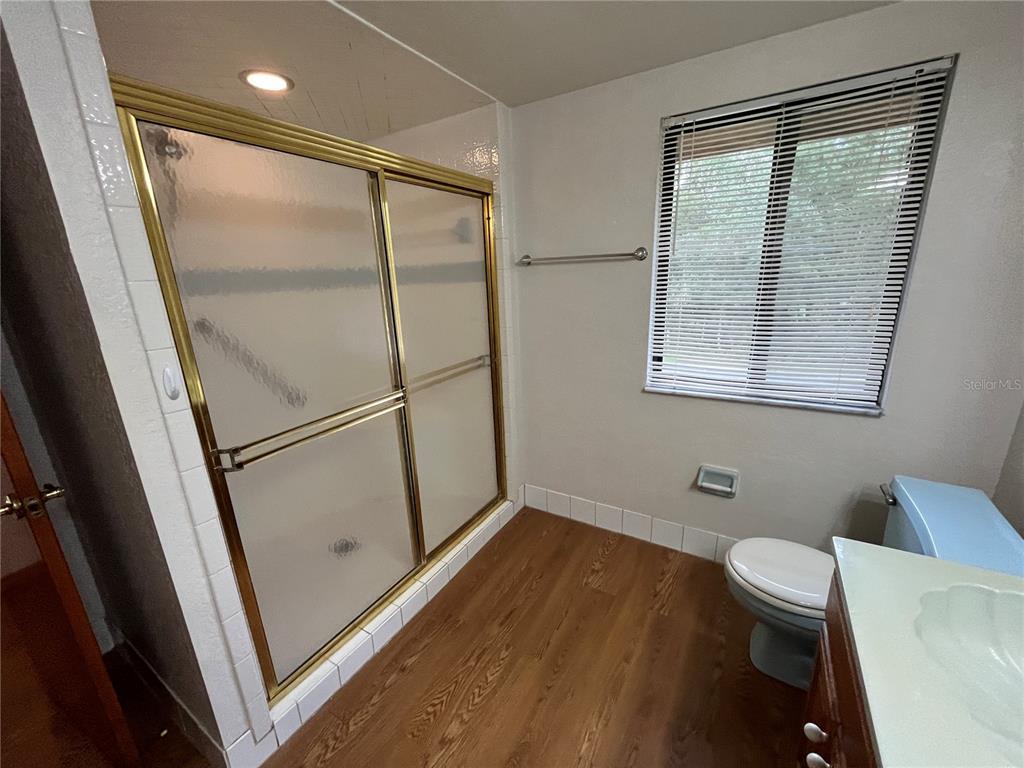 6560 Timberlane Road Lake Wales, FL 33898 - Photo 13 of 31 a bathroom with a toilet and a shower