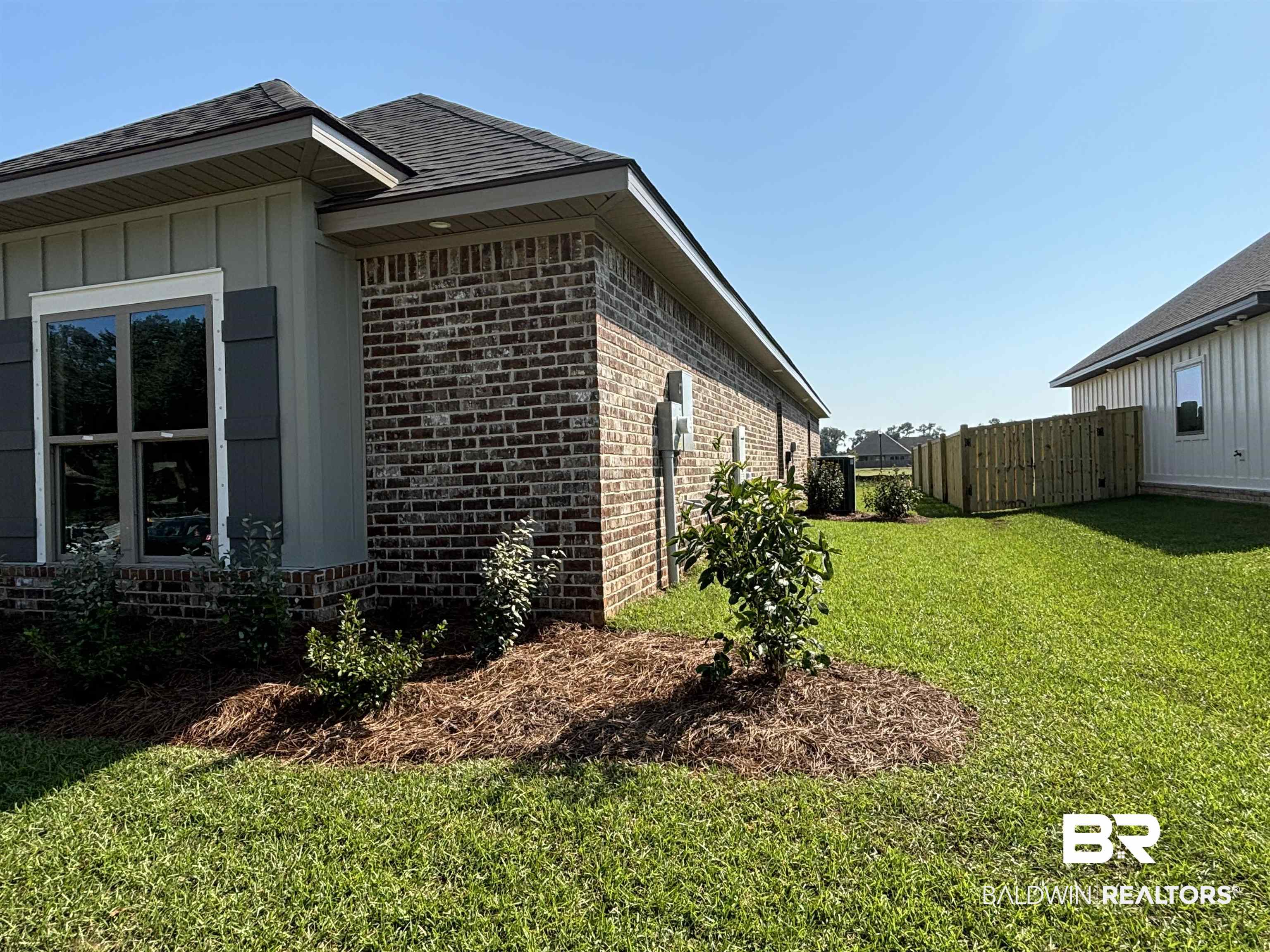 388 Garrison Boulevard Fairhope, AL 36532 - Photo 16 of 34 View of home's exterior with a lawn