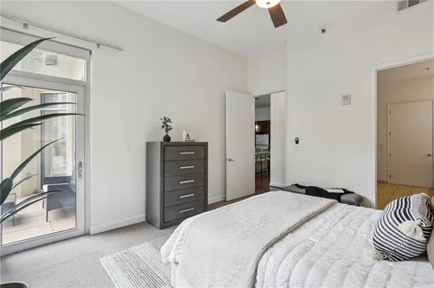 a view of a patio with couches chairs and a potted plant
