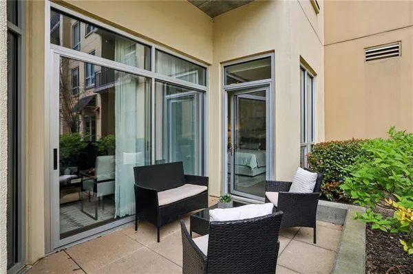 a bathroom with double vanity and a mirror