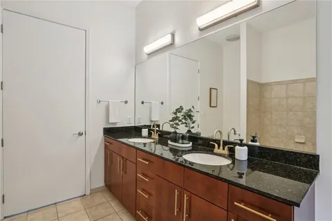 a bathroom with a shower and a shower