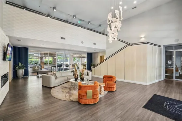 a view of a dining room with furniture wooden floor and a chandelier