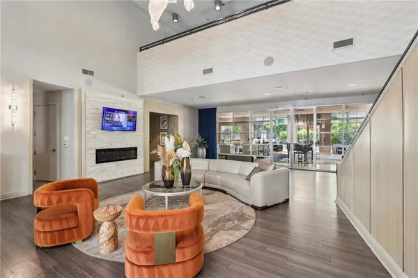 a living room with furniture and a flat screen tv