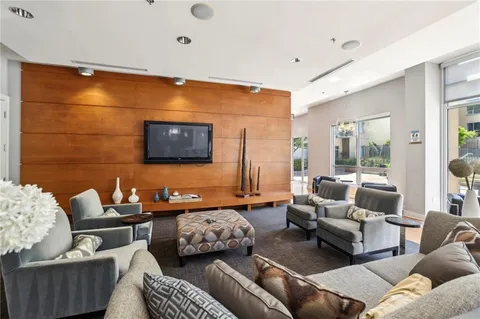 a view of a building with garden and sitting area